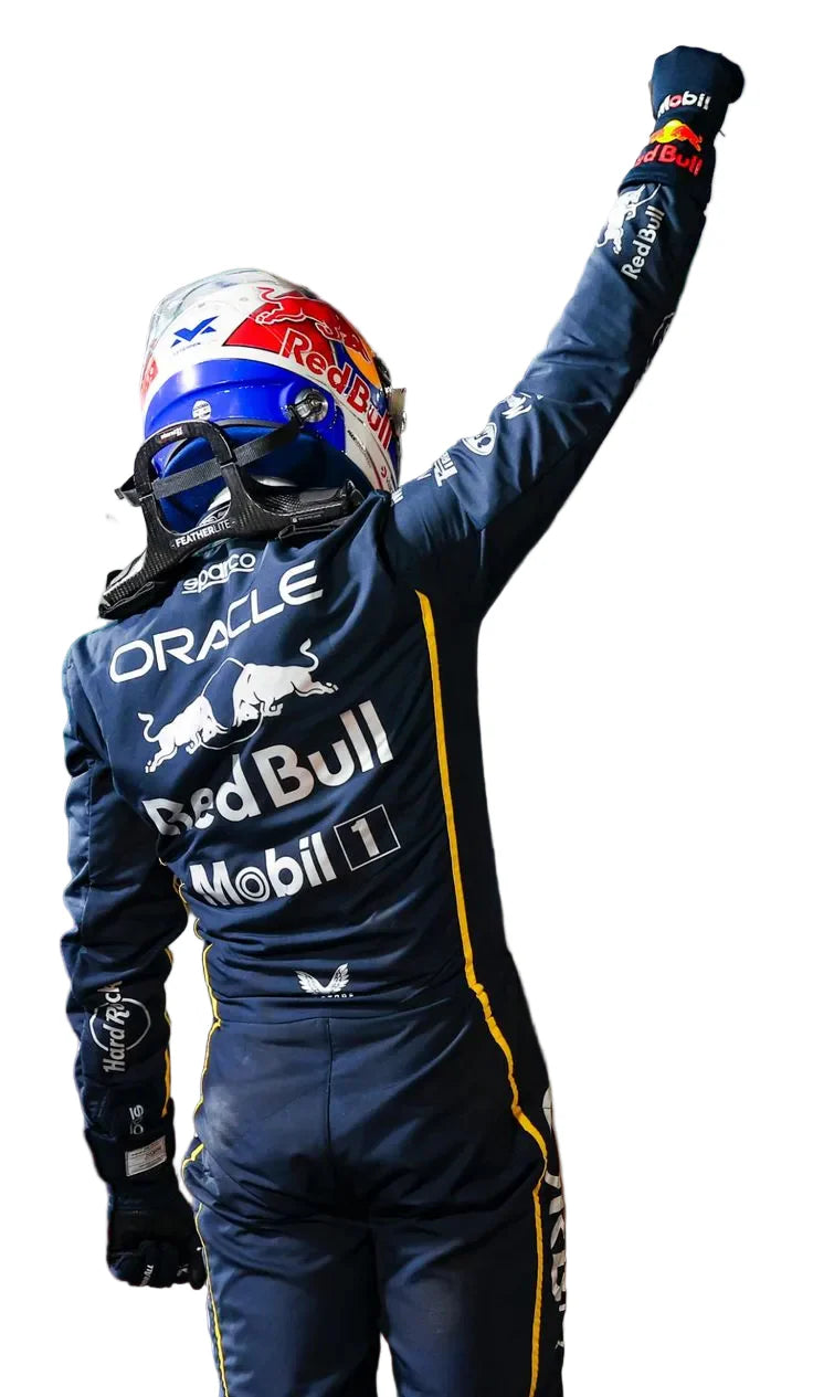 Person in a racing suit with Red Bull and Oracle branding, celebrating with one arm raised.